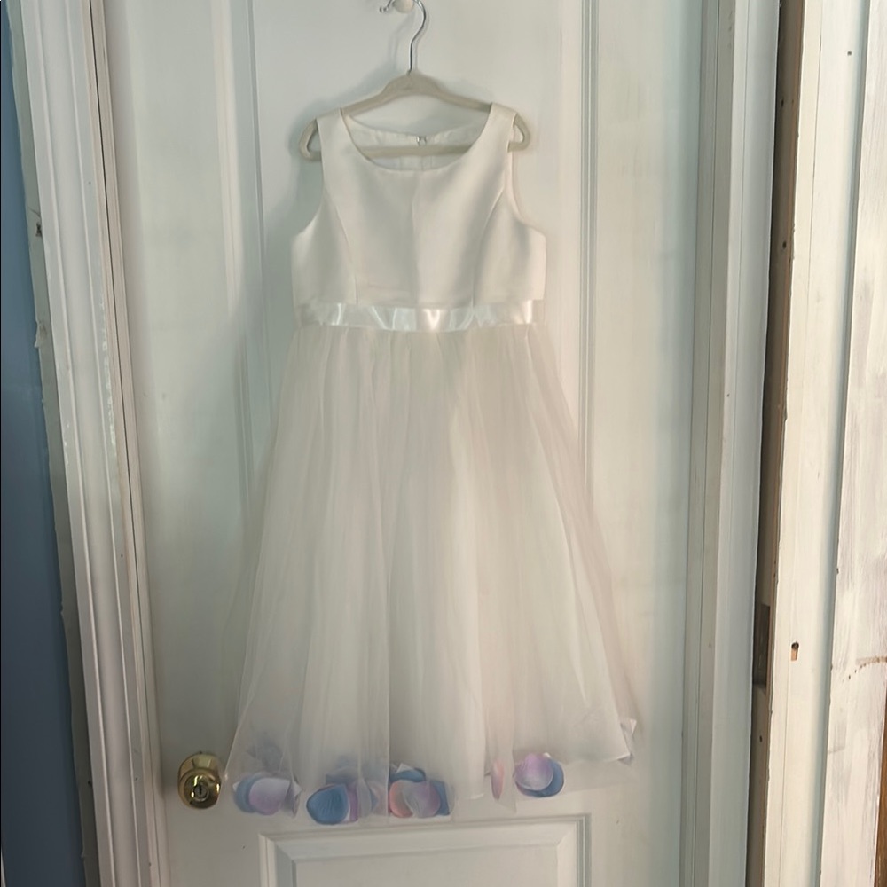 White flower girl dress with pastel flower petal accents